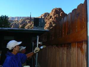 wGCHBA-day3-1  Janie and Becky oil ranger fence.jpg (227454 bytes)